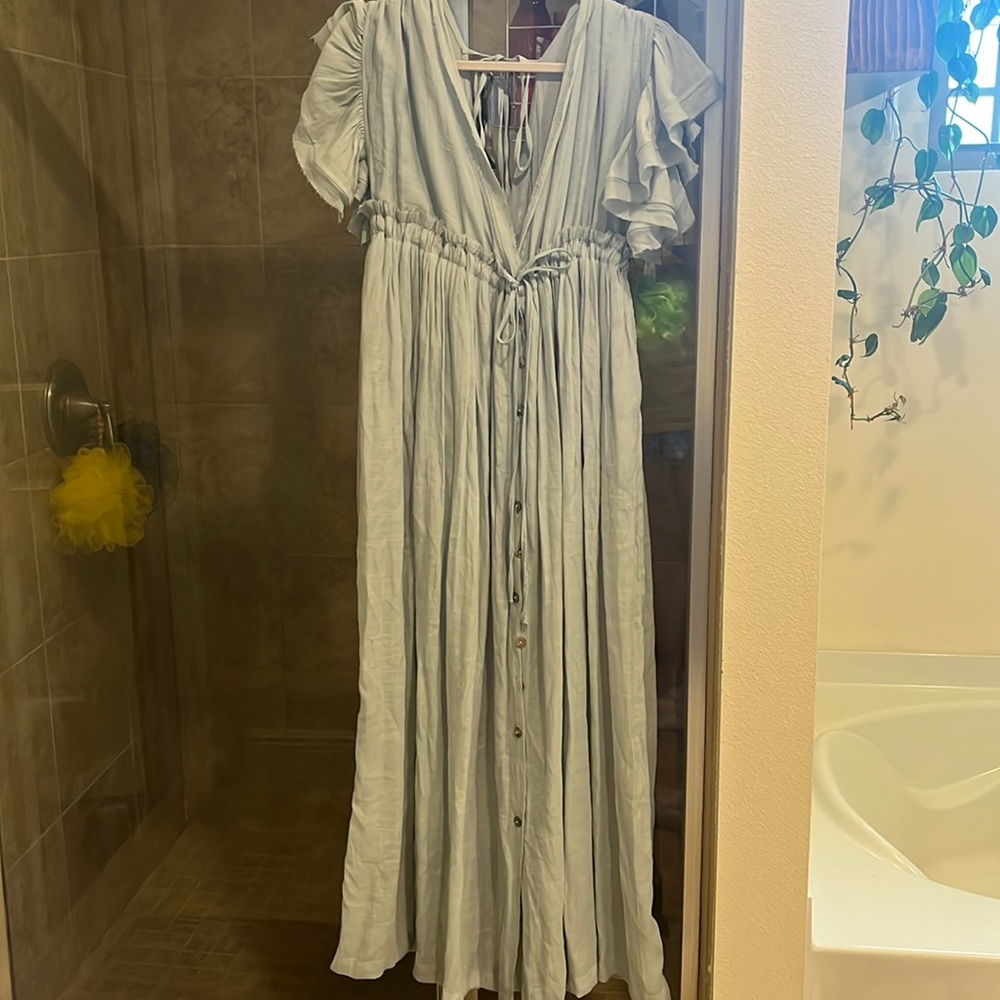 Sky blue linen maxi dress with plunging v neckline and buttons all the way down